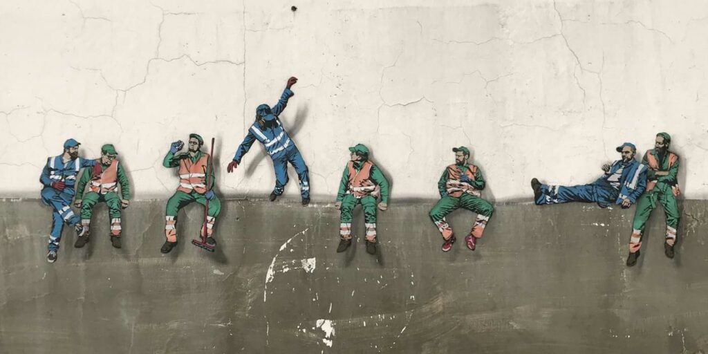 AI job loss image represented by blue collar workers.