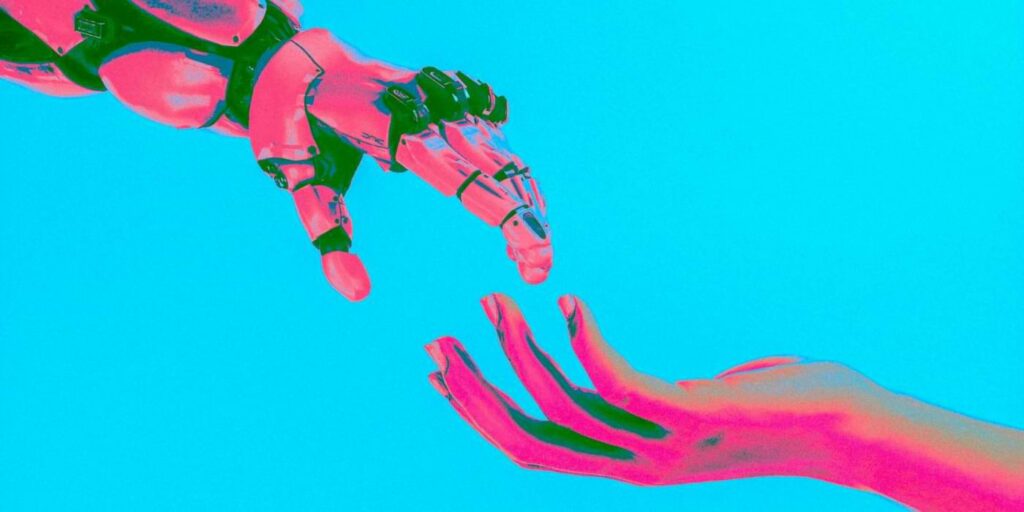 AI in everyday life image featuring a robot and human hand reaching for each other to symbolize the age of AI