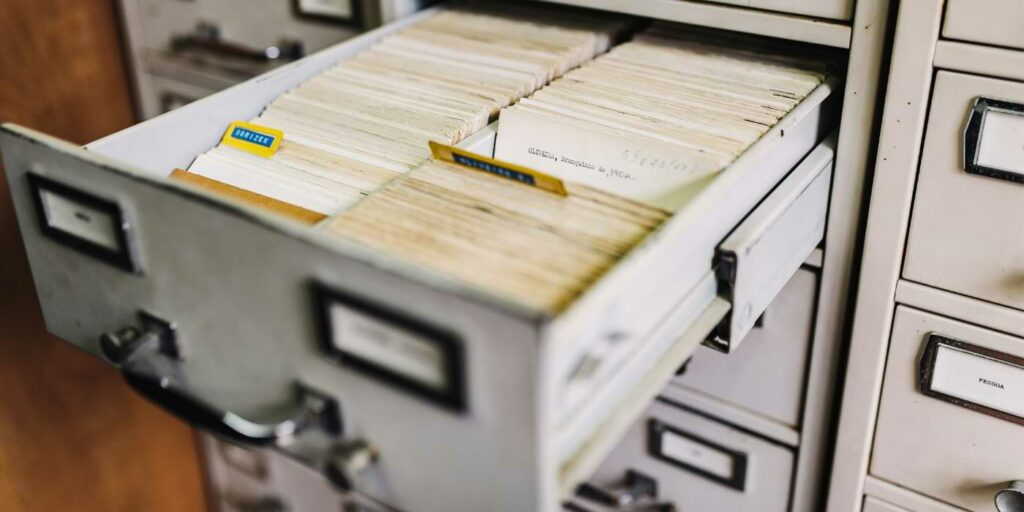 AI in everyday life image featuring a filing cabinet full of files