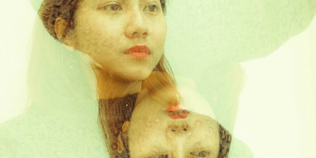 Image of dehumanization depicted by a mirror image of self